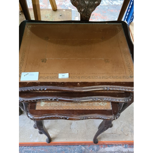 648 - Two items to include a Queen Anne style mahogany nest of three tables with tan leather inserts and a... 