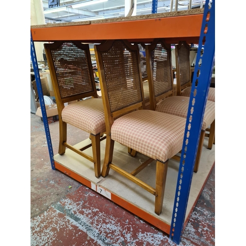 651 - Six modern walnut dining chairs with rattan backs and pink upholstery