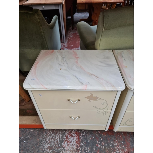 654 - A pair of white laminate two drawer bedside cabinets