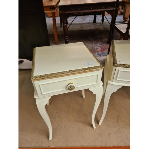 656 - A pair of French style white painted bedside cabinets on cabriole supports