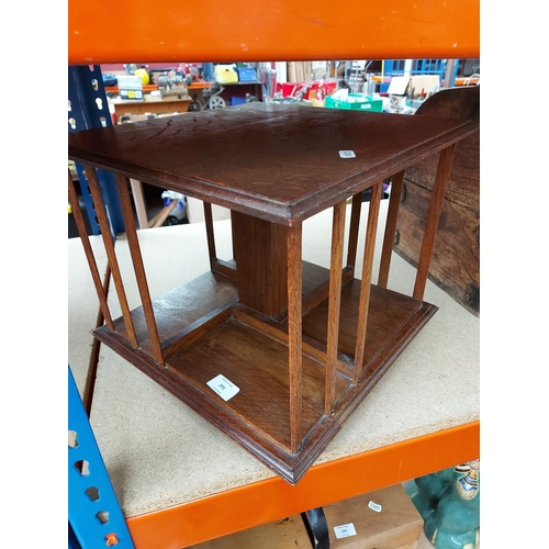 291 - A vintage oak miniature table top revolving bookcase - measuring approx. 32cm high and 38cm wide