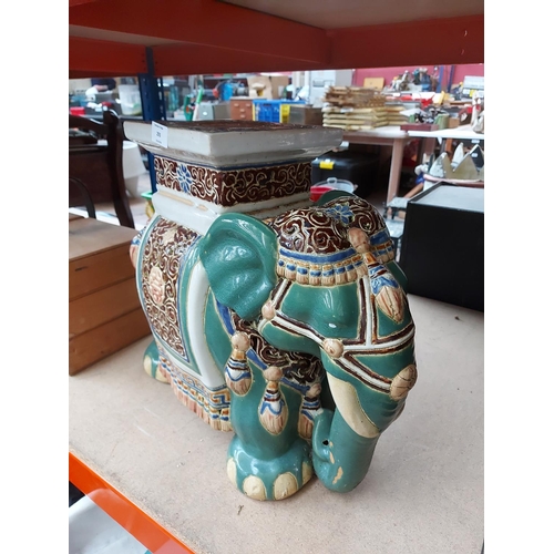 293 - A Middle Eastern style ceramic floor standing elephant plant stand/side table