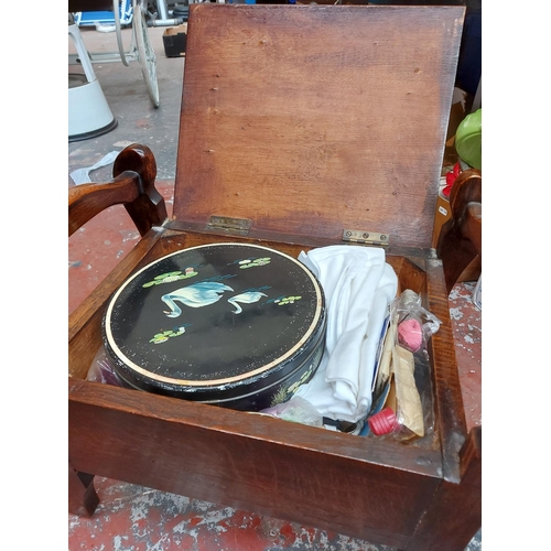 298 - A vintage oak piano stool with green upholstered seat and contents and a small mahogany framed foots... 