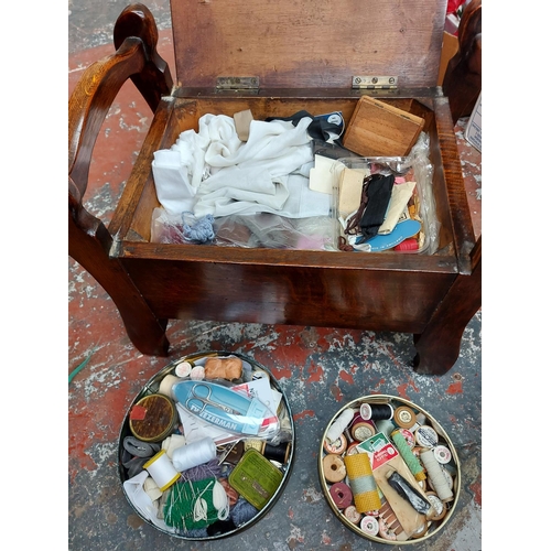 298 - A vintage oak piano stool with green upholstered seat and contents and a small mahogany framed foots... 