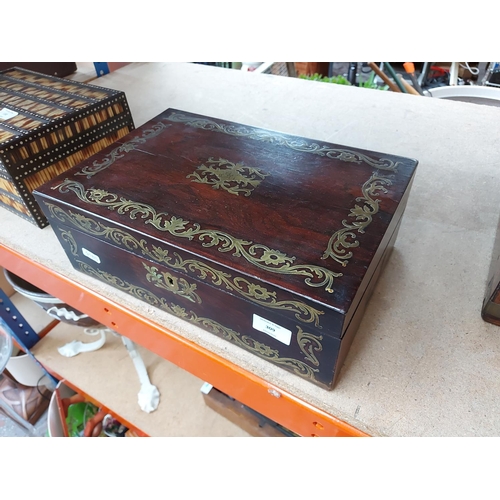 309 - A 19th century mahogany campaign writing box with well detailed brass swag inlay, inset brass handle... 