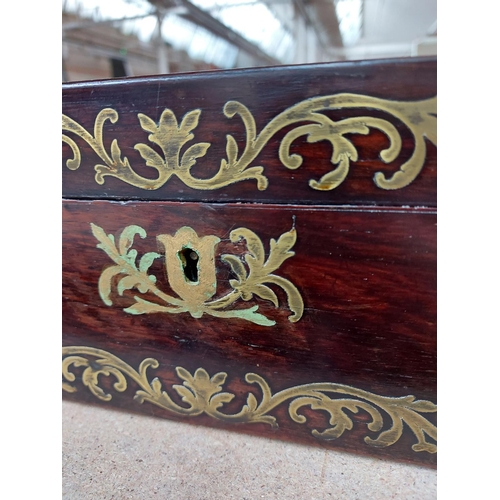 309 - A 19th century mahogany campaign writing box with well detailed brass swag inlay, inset brass handle... 