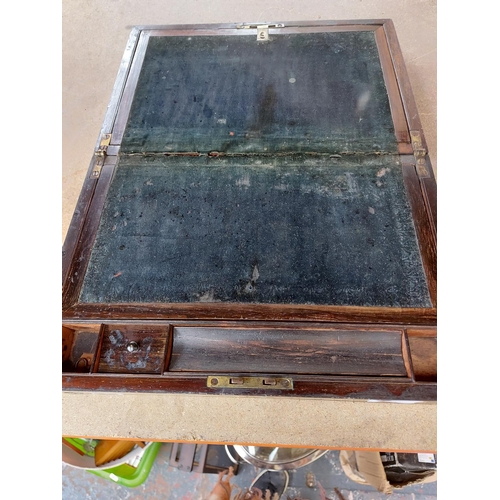 309 - A 19th century mahogany campaign writing box with well detailed brass swag inlay, inset brass handle... 