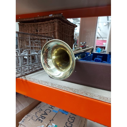 318 - A vintage brown cased brass Rudall Carle & Co LTD trumpet