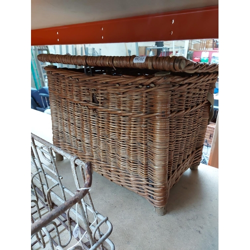 319 - Two items to include a vintage wicker fishing basket and a galvanised metal bottle holder