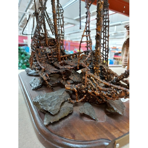 321 - An unusual metal sculpture of of a shipwreck titled ‘Revenge’ measuring approx. 43cm long and 43cm h... 