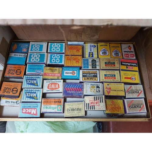 322 - Four boxes containing a large collection of vintage match boxes