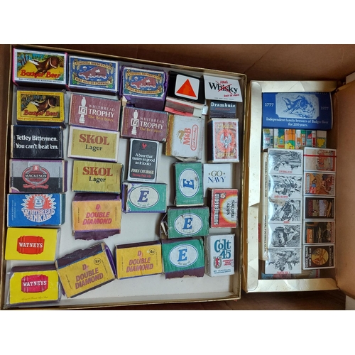 322 - Four boxes containing a large collection of vintage match boxes