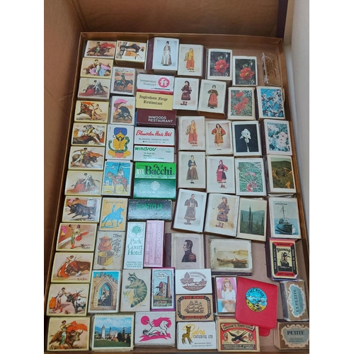 322 - Four boxes containing a large collection of vintage match boxes