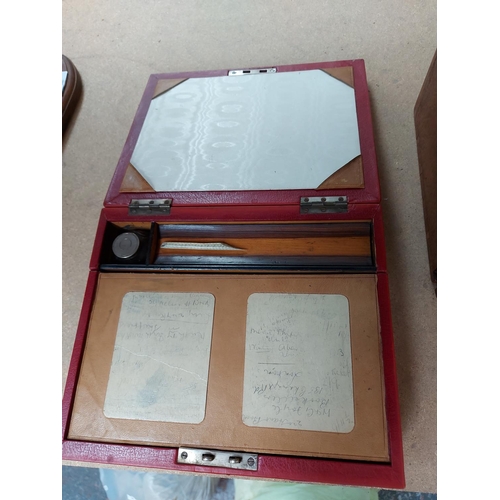 324 - Two items to include a red leather travel writing box and a Georgian mahogany writing slope