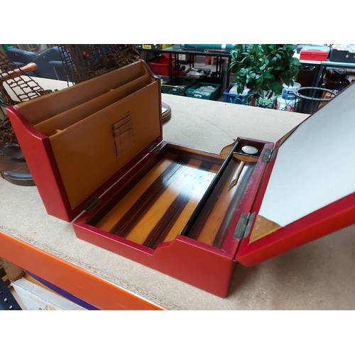 324 - Two items to include a red leather travel writing box and a Georgian mahogany writing slope