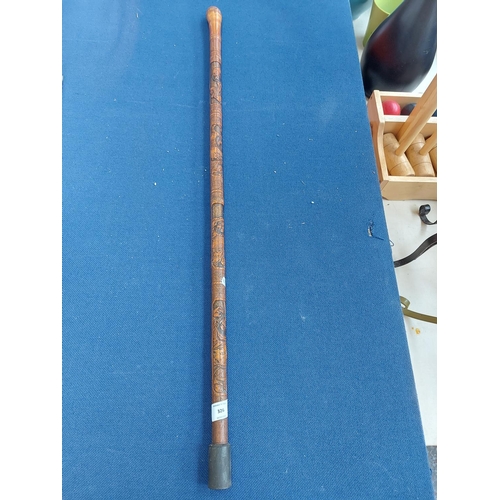 326 - A vintage oriental carved bamboo walking cane