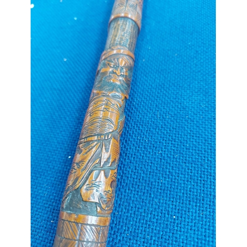 326 - A vintage oriental carved bamboo walking cane