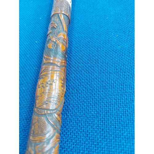 326 - A vintage oriental carved bamboo walking cane