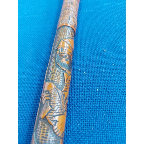 326 - A vintage oriental carved bamboo walking cane