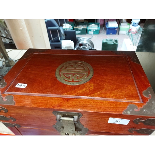 328 - An antique style oriental teak jewellery box with brass buckles, handles and corners with three inte... 