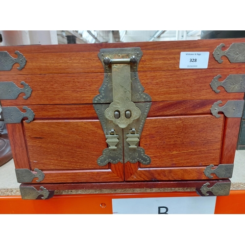 328 - An antique style oriental teak jewellery box with brass buckles, handles and corners with three inte... 