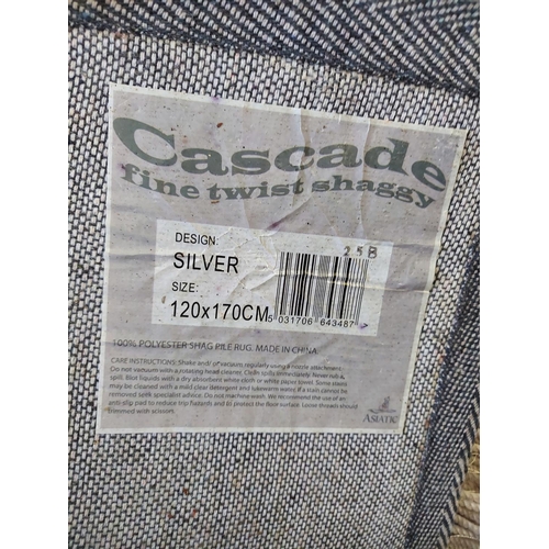 671 - An Asiatic Cascade fine twist shaggy silver shag pile rug - measuring approx. 120cm x 170cm