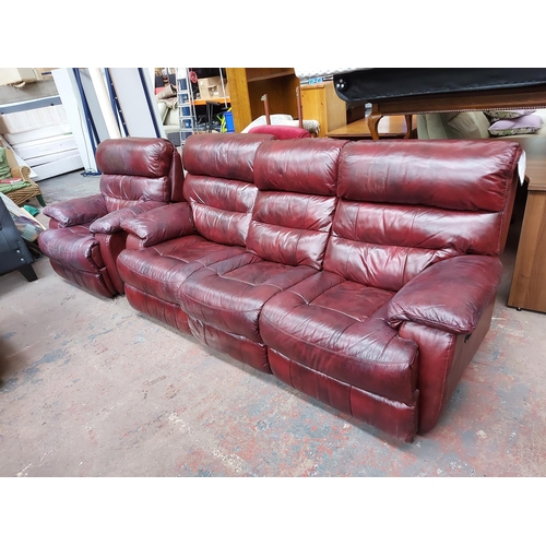 682 - A modern red leather reclining three piece lounge suite comprising three seater sofa, two seater sof... 