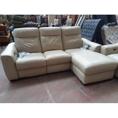 683 - A modern cream leather electric reclining two piece lounge suite comprising L-shaped corner sofa and... 