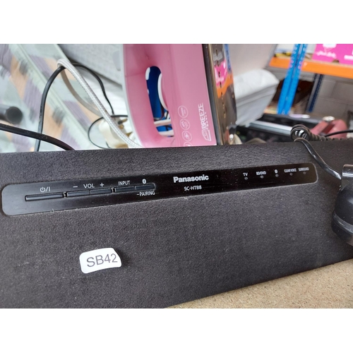 1101 - Three items, a Panasonic SC-HTB8 soundbar with remote, pink and white Morphy Richards steam iron and... 