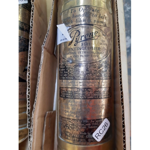 157 - A pair of vintage brass Pyrene fire extinguishers