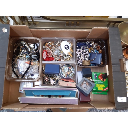 162 - A box of costume jewellery to include necklaces, brooches, cufflinks, boxed folding hand fan, Church... 