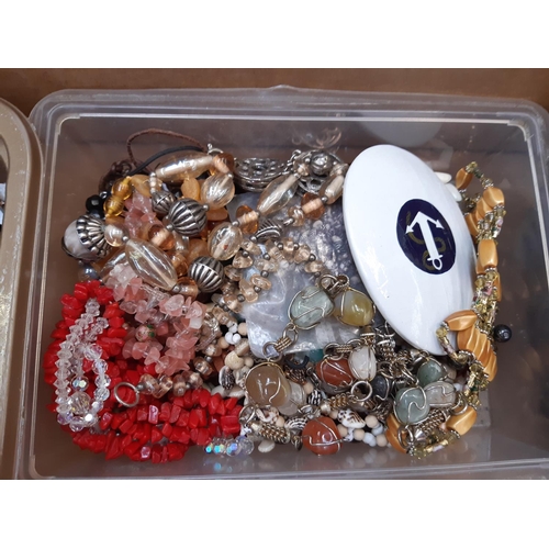 162 - A box of costume jewellery to include necklaces, brooches, cufflinks, boxed folding hand fan, Church... 