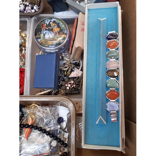 162 - A box of costume jewellery to include necklaces, brooches, cufflinks, boxed folding hand fan, Church... 