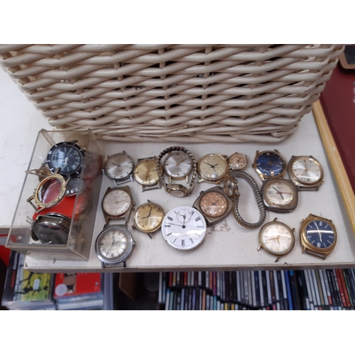 169 - A large collection of watch makers spares and accessories to include various movements, crown winds,... 