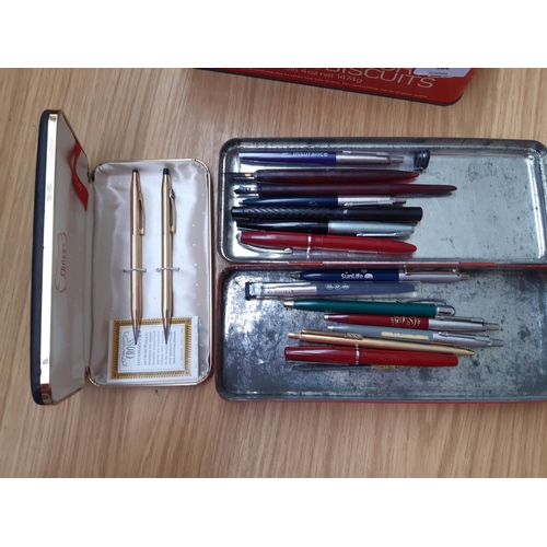 180 - A collection of vintage and modern pens and pencils to include a boxed Cross pencil set, Parker ball... 