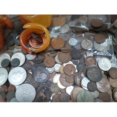 181 - A tin containing a collection of mixed items to include foreign and British coins, as new Doctor Who... 