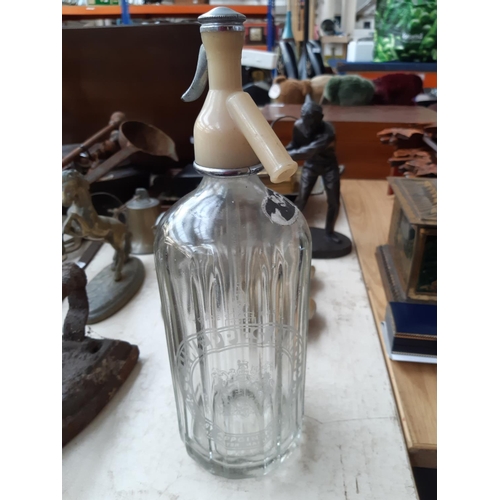 186 - A large collection of mixed items to include vintage Schweppes clear glass soda syphon, brass horse ... 