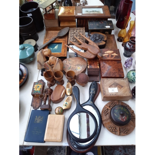 191 - A large collection of treen to include tri footed souvenir pin cushion with Colchester High Street s... 