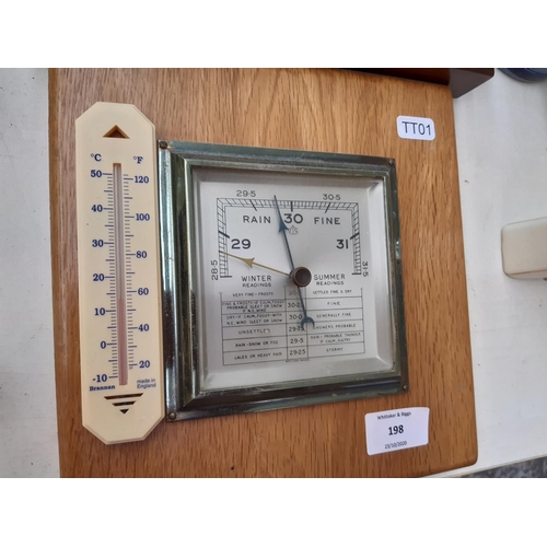 198 - Six items to include a barometer with modern oak plinth back, modern nautical quartz wall clock, tea... 