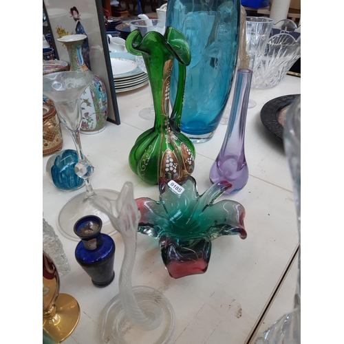 212 - A collection of mixed glassware to include a hand blown Venetian glass snake, Murano style glass bow... 