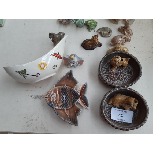 221 - A collection of Wade ceramic ornaments to include tortoises, rabbits, parrot etc.