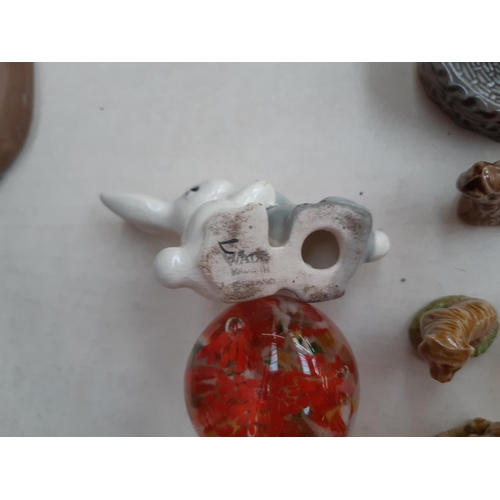 221 - A collection of Wade ceramic ornaments to include tortoises, rabbits, parrot etc.