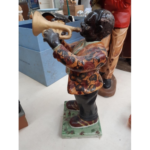 222 - Four vintage Jazz musician figurines to include two fibreglass examples - measuring approx. 56cm hig... 