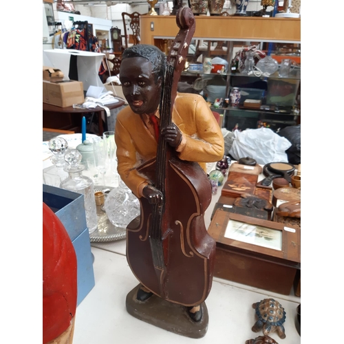 222 - Four vintage Jazz musician figurines to include two fibreglass examples - measuring approx. 56cm hig... 