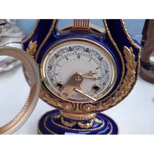 224 - A Victoria & Albert museum antique reproduction French Lyre clock produced by Franklin Mint in 1996,... 