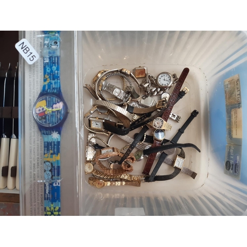 227 - A box containing a collection of various watches to include boxed Swatch watch, Swatch advertising f... 