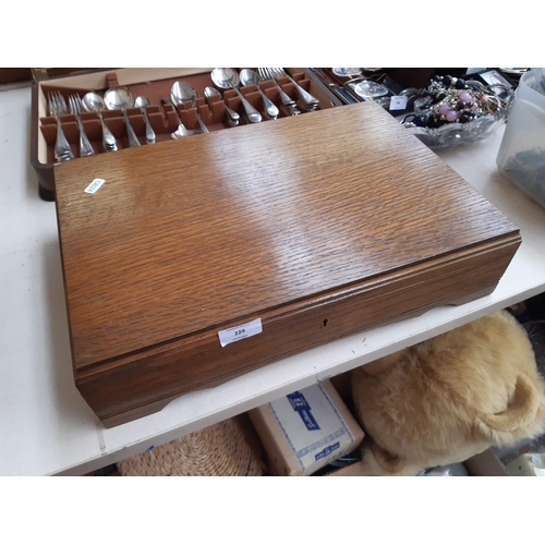 229 - A vintage oak cased part canteen of cutlery