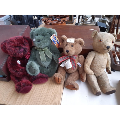 231 - Four vintage and modern Teddy Bears to include a 1950's straw filled articulated bear with leather p... 