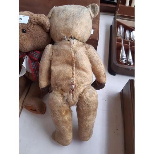 231 - Four vintage and modern Teddy Bears to include a 1950's straw filled articulated bear with leather p... 