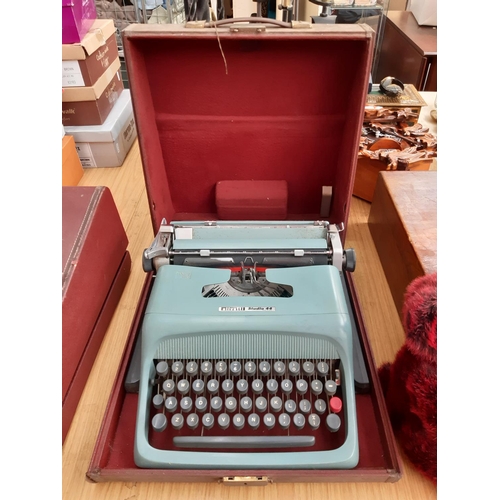 232 - A brown cased Olivetti studio 44 typewriter